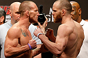 LAS VEGAS, NV - MAY 24:   (L-R) Opponents Gray Maynard and T.J. Grant face off during the UFC 160 weigh-in at the MGM Grand Garden Arena on May 24, 2013 in Las Vegas, Nevada.  (Photo by Josh Hedges/Zuffa LLC/Zuffa LLC via Getty Images)