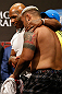 LAS VEGAS, NV - MAY 24:   (L-R) Former heavyweight boxing champion Mike Tyson greets Mark Hunt during the UFC 160 weigh-in at the MGM Grand Garden Arena on May 24, 2013 in Las Vegas, Nevada.  (Photo by Josh Hedges/Zuffa LLC/Zuffa LLC via Getty Images)