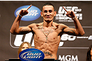 LAS VEGAS, NV - MAY 24:   Max Holloway weighs in during the UFC 160 weigh-in at the MGM Grand Garden Arena on May 24, 2013 in Las Vegas, Nevada.  (Photo by Josh Hedges/Zuffa LLC/Zuffa LLC via Getty Images)