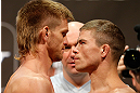 LAS VEGAS, NV - MAY 24:   (L-R) Opponents Mike Pyle and Rick Story face off during the UFC 160 weigh-in at the MGM Grand Garden Arena on May 24, 2013 in Las Vegas, Nevada.  (Photo by Josh Hedges/Zuffa LLC/Zuffa LLC via Getty Images)