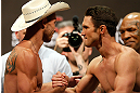 LAS VEGAS, NV - MAY 24:   (L-R) Opponents Donald "Cowboy" Cerrone and Karl "K.J." Noons shake hands during the UFC 160 weigh-in at the MGM Grand Garden Arena on May 24, 2013 in Las Vegas, Nevada.  (Photo by Josh Hedges/Zuffa LLC/Zuffa LLC via Getty Images)