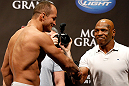 LAS VEGAS, NV - MAY 24:   (R-L) Former heavyweight boxing champion Mike Tyson greets Junior dos Santos during the UFC 160 weigh-in at the MGM Grand Garden Arena on May 24, 2013 in Las Vegas, Nevada.  (Photo by Josh Hedges/Zuffa LLC/Zuffa LLC via Getty Images)