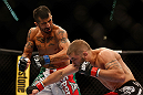 LAS VEGAS, NV - MAY 25:   (L-R) Estevan Payan punches Jeremy Stephens in their featherweight bout during UFC 160 at the MGM Grand Garden Arena on May 25, 2013 in Las Vegas, Nevada.  (Photo by Josh Hedges/Zuffa LLC/Zuffa LLC via Getty Images)  *** Local Caption *** Jeremy Stephens; Estevan Payan