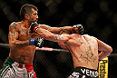 LAS VEGAS, NV - MAY 25:   (R-L) Jeremy Stephens punches Estevan Payan in their featherweight bout during UFC 160 at the MGM Grand Garden Arena on May 25, 2013 in Las Vegas, Nevada.  (Photo by Josh Hedges/Zuffa LLC/Zuffa LLC via Getty Images)  *** Local Caption *** Jeremy Stephens; Estevan Payan