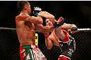 LAS VEGAS, NV - MAY 25:   (R-L) Jeremy Stephens kicks Estevan Payan in their featherweight bout during UFC 160 at the MGM Grand Garden Arena on May 25, 2013 in Las Vegas, Nevada.  (Photo by Josh Hedges/Zuffa LLC/Zuffa LLC via Getty Images)  *** Local Caption *** Jeremy Stephens; Estevan Payan