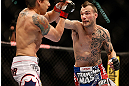LAS VEGAS, NV - MAY 25:   (L-R) George Roop punches Brian Bowles in their bantamweight bout during UFC 160 at the MGM Grand Garden Arena on May 25, 2013 in Las Vegas, Nevada.  (Photo by Josh Hedges/Zuffa LLC/Zuffa LLC via Getty Images)  *** Local Caption *** Brian Bowles; George Roop