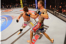 LAS VEGAS, NV - MAY 25:   (R-L) George Roop punches Brian Bowles in their bantamweight bout during UFC 160 at the MGM Grand Garden Arena on May 25, 2013 in Las Vegas, Nevada.  (Photo by Donald Miralle/Zuffa LLC/Zuffa LLC via Getty Images)  *** Local Caption *** Brian Bowles; George Roop