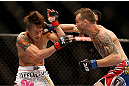LAS VEGAS, NV - MAY 25:   (R-L) George Roop punches Brian Bowles in their bantamweight bout during UFC 160 at the MGM Grand Garden Arena on May 25, 2013 in Las Vegas, Nevada.  (Photo by Josh Hedges/Zuffa LLC/Zuffa LLC via Getty Images)  *** Local Caption *** Brian Bowles; George Roop