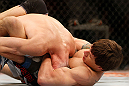 LAS VEGAS, NV - MAY 25:   (R-L) Brian Bowles attempts to submit George Roop in their bantamweight bout during UFC 160 at the MGM Grand Garden Arena on May 25, 2013 in Las Vegas, Nevada.  (Photo by Josh Hedges/Zuffa LLC/Zuffa LLC via Getty Images)  *** Local Caption *** Brian Bowles; George Roop