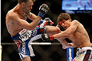 LAS VEGAS, NV - MAY 25:   George Roop (left) kicks Brian Bowles in their bantamweight bout during UFC 160 at the MGM Grand Garden Arena on May 25, 2013 in Las Vegas, Nevada.  (Photo by Josh Hedges/Zuffa LLC/Zuffa LLC via Getty Images)  *** Local Caption *** Brian Bowles; George Roop