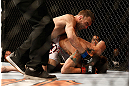 LAS VEGAS, NV - MAY 25:   George Roop (top) punches Brian Bowles in their bantamweight bout during UFC 160 at the MGM Grand Garden Arena on May 25, 2013 in Las Vegas, Nevada.  (Photo by Josh Hedges/Zuffa LLC/Zuffa LLC via Getty Images)  *** Local Caption *** Brian Bowles; George Roop