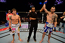 LAS VEGAS, NV - MAY 25:   George Roop (right) reacts to his victory over Brian Bowles (left) in their bantamweight bout during UFC 160 at the MGM Grand Garden Arena on May 25, 2013 in Las Vegas, Nevada.  (Photo by Donald Miralle/Zuffa LLC/Zuffa LLC via Getty Images)  *** Local Caption *** Brian Bowles; George Roop