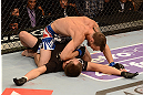 LAS VEGAS, NV - MAY 25:   George Roop (top) celebrates his win over Brian Bowles with his cornerman in their bantamweight bout during UFC 160 at the MGM Grand Garden Arena on May 25, 2013 in Las Vegas, Nevada.  (Photo by Donald Miralle/Zuffa LLC/Zuffa LLC via Getty Images)  *** Local Caption *** Brian Bowles; George Roop