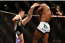 LAS VEGAS, NV - MAY 25:   (L-R) Stephen Thompson kicks Nah-Shon Burrell in their welterweight bout during UFC 160 at the MGM Grand Garden Arena on May 25, 2013 in Las Vegas, Nevada.  (Photo by Josh Hedges/Zuffa LLC/Zuffa LLC via Getty Images)  *** Local Caption *** Stephen Thompson; Nah-Shon Burrell