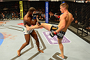 LAS VEGAS, NV - MAY 25:   (R-L) Stephen Thompson kicks Nah-Shon Burrell in their welterweight bout during UFC 160 at the MGM Grand Garden Arena on May 25, 2013 in Las Vegas, Nevada.  (Photo by Donald Miralle/Zuffa LLC/Zuffa LLC via Getty Images)  *** Local Caption *** Stephen Thompson; Nah-Shon Burrell