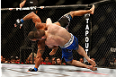 LAS VEGAS, NV - MAY 25:   Khabib Nurmagomedov (blue shorts) slams Abel Trujillo in their lightweight bout during UFC 160 at the MGM Grand Garden Arena on May 25, 2013 in Las Vegas, Nevada.  (Photo by Josh Hedges/Zuffa LLC/Zuffa LLC via Getty Images)  *** Local Caption *** Khabib Nurmagomedov; Abel Trujillo