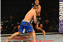 LAS VEGAS, NV - MAY 25:   Khabib Nurmagomedov (blue shorts) punches Abel Trujillo in their lightweight bout during UFC 160 at the MGM Grand Garden Arena on May 25, 2013 in Las Vegas, Nevada.  (Photo by Donald Miralle/Zuffa LLC/Zuffa LLC via Getty Images)  *** Local Caption *** Khabib Nurmagomedov; Abel Trujillo