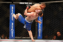 LAS VEGAS, NV - MAY 25:   Khabib Nurmagomedov (blue shorts) slams Abel Trujillo in their lightweight bout during UFC 160 at the MGM Grand Garden Arena on May 25, 2013 in Las Vegas, Nevada.  (Photo by Josh Hedges/Zuffa LLC/Zuffa LLC via Getty Images)  *** Local Caption *** Khabib Nurmagomedov; Abel Trujillo