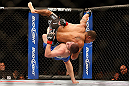 LAS VEGAS, NV - MAY 25:   Khabib Nurmagomedov (blue shorts) slams Abel Trujillo in their lightweight bout during UFC 160 at the MGM Grand Garden Arena on May 25, 2013 in Las Vegas, Nevada.  (Photo by Josh Hedges/Zuffa LLC/Zuffa LLC via Getty Images)  *** Local Caption *** Khabib Nurmagomedov; Abel Trujillo