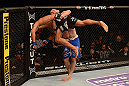 LAS VEGAS, NV - MAY 25:   Khabib Nurmagomedov (blue shorts) lifts Abel Trujillo for a slam in their lightweight bout during UFC 160 at the MGM Grand Garden Arena on May 25, 2013 in Las Vegas, Nevada.  (Photo by Donald Miralle/Zuffa LLC/Zuffa LLC via Getty Images)  *** Local Caption *** Khabib Nurmagomedov; Abel Trujillo