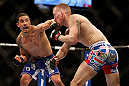 LAS VEGAS, NV - MAY 25:   (L-R) Robert Whittaker punches Colton Smith in their welterweight bout during UFC 160 at the MGM Grand Garden Arena on May 25, 2013 in Las Vegas, Nevada.  (Photo by Josh Hedges/Zuffa LLC/Zuffa LLC via Getty Images)  *** Local Caption *** Colton Smith; Robert Whittaker