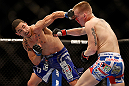 LAS VEGAS, NV - MAY 25:   (L-R) Robert Whittaker punches Colton Smith in their welterweight bout during UFC 160 at the MGM Grand Garden Arena on May 25, 2013 in Las Vegas, Nevada.  (Photo by Josh Hedges/Zuffa LLC/Zuffa LLC via Getty Images)  *** Local Caption *** Colton Smith; Robert Whittaker