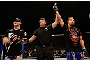 LAS VEGAS, NV - MAY 25:   Robert Whittaker (right) reacts to his victory over Colton Smith (left) in their welterweight bout during UFC 160 at the MGM Grand Garden Arena on May 25, 2013 in Las Vegas, Nevada.  (Photo by Donald Miralle/Zuffa LLC/Zuffa LLC via Getty Images)  *** Local Caption *** Colton Smith; Robert Whittaker