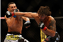LAS VEGAS, NV - MAY 25:   (R-L) Dennis Bermudez punches Max Holloway in their featherweight bout during UFC 160 at the MGM Grand Garden Arena on May 25, 2013 in Las Vegas, Nevada.  (Photo by Josh Hedges/Zuffa LLC/Zuffa LLC via Getty Images)  *** Local Caption *** Dennis Bermudez; Max Holloway