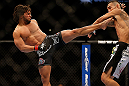 LAS VEGAS, NV - MAY 25:   (L-R) Dennis Bermudez kicks Max Holloway in their featherweight bout during UFC 160 at the MGM Grand Garden Arena on May 25, 2013 in Las Vegas, Nevada.  (Photo by Josh Hedges/Zuffa LLC/Zuffa LLC via Getty Images)  *** Local Caption *** Dennis Bermudez; Max Holloway