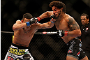 LAS VEGAS, NV - MAY 25:   (L-R) Max Holloway punches Dennis Bermudez in their featherweight bout during UFC 160 at the MGM Grand Garden Arena on May 25, 2013 in Las Vegas, Nevada.  (Photo by Josh Hedges/Zuffa LLC/Zuffa LLC via Getty Images)  *** Local Caption *** Dennis Bermudez; Max Holloway