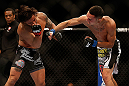 LAS VEGAS, NV - MAY 25:   (R-L) Max Holloway punches Dennis Bermudez in their featherweight bout during UFC 160 at the MGM Grand Garden Arena on May 25, 2013 in Las Vegas, Nevada.  (Photo by Josh Hedges/Zuffa LLC/Zuffa LLC via Getty Images)  *** Local Caption *** Dennis Bermudez; Max Holloway
