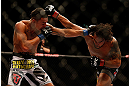LAS VEGAS, NV - MAY 25:   (L-R) Dennis Bermudez punches Max Holloway in their featherweight bout during UFC 160 at the MGM Grand Garden Arena on May 25, 2013 in Las Vegas, Nevada.  (Photo by Josh Hedges/Zuffa LLC/Zuffa LLC via Getty Images)  *** Local Caption *** Dennis Bermudez; Max Holloway