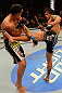LAS VEGAS, NV - MAY 25:   (R-L) Dennis Bermudez kicks Max Holloway in their featherweight bout during UFC 160 at the MGM Grand Garden Arena on May 25, 2013 in Las Vegas, Nevada.  (Photo by Donald Miralle/Zuffa LLC/Zuffa LLC via Getty Images)  *** Local Caption *** Dennis Bermudez; Max Holloway