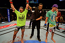 LAS VEGAS, NV - MAY 25:   Dennis Bermudez (left) reacts to his victory over Max Holloway (right) in their featherweight bout during UFC 160 at the MGM Grand Garden Arena on May 25, 2013 in Las Vegas, Nevada.  (Photo by Donald Miralle/Zuffa LLC/Zuffa LLC via Getty Images)  *** Local Caption *** Dennis Bermudez; Max Holloway