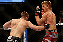 LAS VEGAS, NV - MAY 25:   (L-R) Rick Story punches Mike Pyle in their welterweight bout during UFC 160 at the MGM Grand Garden Arena on May 25, 2013 in Las Vegas, Nevada.  (Photo by Josh Hedges/Zuffa LLC/Zuffa LLC via Getty Images)  *** Local Caption *** Mike Pyle; Rick Story