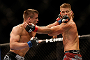 LAS VEGAS, NV - MAY 25:   (L-R) Rick Story punches Mike Pyle in their welterweight bout during UFC 160 at the MGM Grand Garden Arena on May 25, 2013 in Las Vegas, Nevada.  (Photo by Josh Hedges/Zuffa LLC/Zuffa LLC via Getty Images)  *** Local Caption *** Mike Pyle; Rick Story