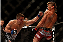 LAS VEGAS, NV - MAY 25:   (L-R) Rick Story punches Mike Pyle in their welterweight bout during UFC 160 at the MGM Grand Garden Arena on May 25, 2013 in Las Vegas, Nevada.  (Photo by Josh Hedges/Zuffa LLC/Zuffa LLC via Getty Images)  *** Local Caption *** Mike Pyle; Rick Story