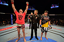 LAS VEGAS, NV - MAY 25:   Mike Pyle (left) reacts to his victory over Rick Story (right) in their welterweight bout during UFC 160 at the MGM Grand Garden Arena on May 25, 2013 in Las Vegas, Nevada.  (Photo by Donald Miralle/Zuffa LLC/Zuffa LLC via Getty Images)  *** Local Caption *** Mike Pyle; Rick Story