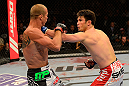 LAS VEGAS, NV - MAY 25:   (R-L) Karl Noons punches Donald Cerrone in their lightweight bout during UFC 160 at the MGM Grand Garden Arena on May 25, 2013 in Las Vegas, Nevada.  (Photo by Donald Miralle/Zuffa LLC/Zuffa LLC via Getty Images)  *** Local Caption *** Donald Cerrone; Karl Noons