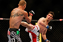LAS VEGAS, NV - MAY 25:   (R-L) Karl Noons kicks Donald Cerrone in their lightweight bout during UFC 160 at the MGM Grand Garden Arena on May 25, 2013 in Las Vegas, Nevada.  (Photo by Josh Hedges/Zuffa LLC/Zuffa LLC via Getty Images)  *** Local Caption *** Donald Cerrone; Karl Noons