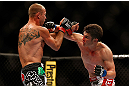 LAS VEGAS, NV - MAY 25:   (R-L) Karl Noons punches Donald Cerrone in their lightweight bout during UFC 160 at the MGM Grand Garden Arena on May 25, 2013 in Las Vegas, Nevada.  (Photo by Josh Hedges/Zuffa LLC/Zuffa LLC via Getty Images)  *** Local Caption *** Donald Cerrone; Karl Noons