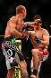 LAS VEGAS, NV - MAY 25:   (L-R) Donald Cerrone punches Karl Noons in their lightweight bout during UFC 160 at the MGM Grand Garden Arena on May 25, 2013 in Las Vegas, Nevada.  (Photo by Josh Hedges/Zuffa LLC/Zuffa LLC via Getty Images)  *** Local Caption *** Donald Cerrone; Karl Noons