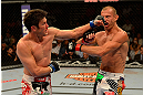 LAS VEGAS, NV - MAY 25:   (L-R) Karl Noons punches Donald Cerrone in their lightweight bout during UFC 160 at the MGM Grand Garden Arena on May 25, 2013 in Las Vegas, Nevada.  (Photo by Donald Miralle/Zuffa LLC/Zuffa LLC via Getty Images)  *** Local Caption *** Donald Cerrone; Karl Noons