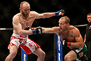 LAS VEGAS, NV - MAY 25:   (R-L) Gray Maynard punches T.J. Grant in their lightweight bout during UFC 160 at the MGM Grand Garden Arena on May 25, 2013 in Las Vegas, Nevada.  (Photo by Josh Hedges/Zuffa LLC/Zuffa LLC via Getty Images)  *** Local Caption *** Gray Maynard; T.J. Grant