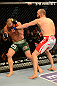 LAS VEGAS, NV - MAY 25:   (R-L) T.J. Grant punches Gray Maynard in their lightweight bout during UFC 160 at the MGM Grand Garden Arena on May 25, 2013 in Las Vegas, Nevada.  (Photo by Donald Miralle/Zuffa LLC/Zuffa LLC via Getty Images)  *** Local Caption *** Gray Maynard; T.J. Grant