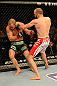 LAS VEGAS, NV - MAY 25:   (R-L) T.J. Grant punches Gray Maynard in their lightweight bout during UFC 160 at the MGM Grand Garden Arena on May 25, 2013 in Las Vegas, Nevada.  (Photo by Donald Miralle/Zuffa LLC/Zuffa LLC via Getty Images)  *** Local Caption *** Gray Maynard; T.J. Grant