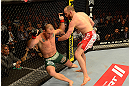 LAS VEGAS, NV - MAY 25:   (R-L) T.J. Grant punches Gray Maynard in their lightweight bout during UFC 160 at the MGM Grand Garden Arena on May 25, 2013 in Las Vegas, Nevada.  (Photo by Donald Miralle/Zuffa LLC/Zuffa LLC via Getty Images)  *** Local Caption *** Gray Maynard; T.J. Grant