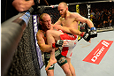 LAS VEGAS, NV - MAY 25:   (R-L) T.J. Grant knees Gray Maynard in their lightweight bout during UFC 160 at the MGM Grand Garden Arena on May 25, 2013 in Las Vegas, Nevada.  (Photo by Donald Miralle/Zuffa LLC/Zuffa LLC via Getty Images)  *** Local Caption *** Gray Maynard; T.J. Grant