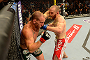 LAS VEGAS, NV - MAY 25:   (R-L) T.J. Grant punches Gray Maynard in their lightweight bout during UFC 160 at the MGM Grand Garden Arena on May 25, 2013 in Las Vegas, Nevada.  (Photo by Donald Miralle/Zuffa LLC/Zuffa LLC via Getty Images)  *** Local Caption *** Gray Maynard; T.J. Grant
