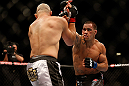 LAS VEGAS, NV - MAY 25:   (R-L) James Te-Huna punches Glover Teixeira in their light heavyweight bout during UFC 160 at the MGM Grand Garden Arena on May 25, 2013 in Las Vegas, Nevada.  (Photo by Josh Hedges/Zuffa LLC/Zuffa LLC via Getty Images)  *** Local Caption *** Glover Teixeira; James Te-Huna